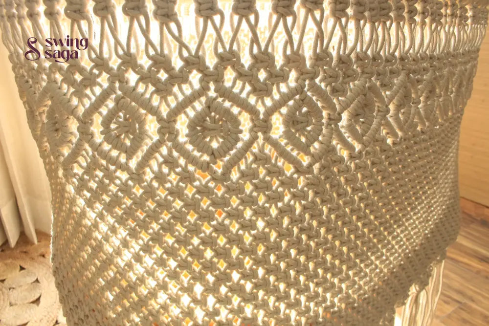 detailed image of Natural cotton macrame hanging swing chair with tassels – stylish indoor boho swing for home décor

