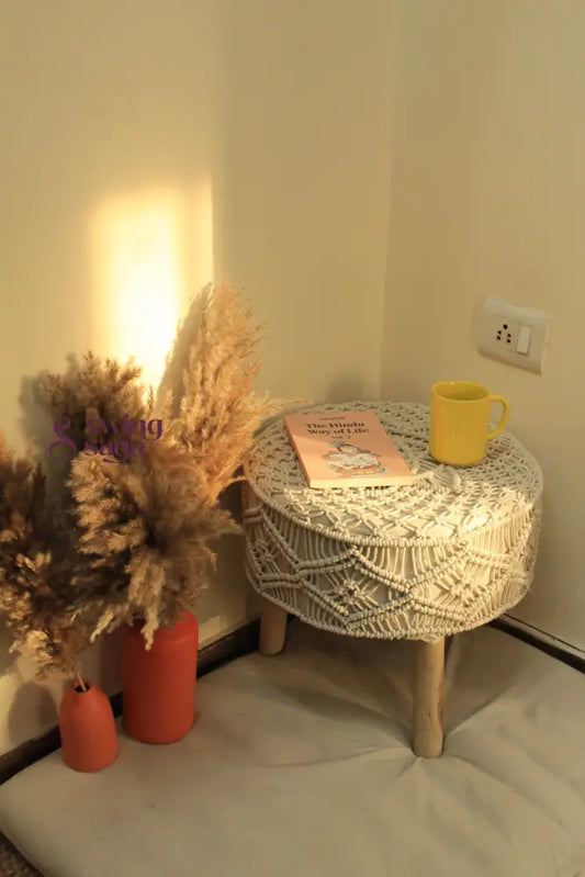 white macrame handcrafted ottoman with  terracotta vases