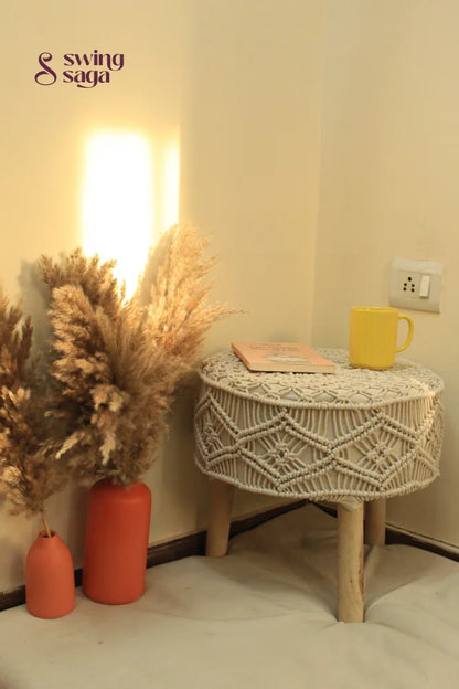white macrame handcrafted ottoman with  terracotta vases
