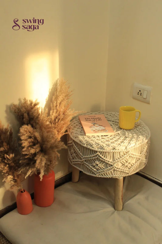 white macrame handcrafted ottoman with  terracotta vases
