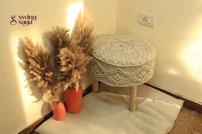 white macrame handcrafted ottoman with  terracotta vases