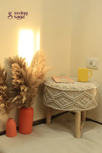 white macrame handcrafted ottoman with  terracotta vases