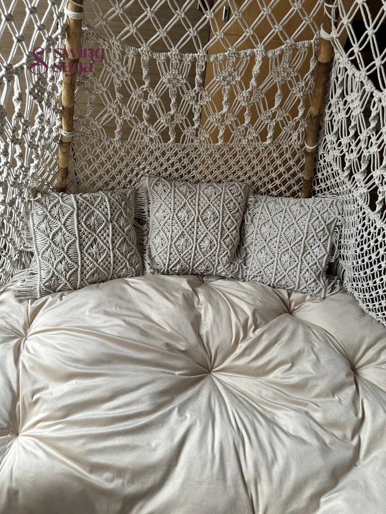 Close up shot of a white macrame teepee.