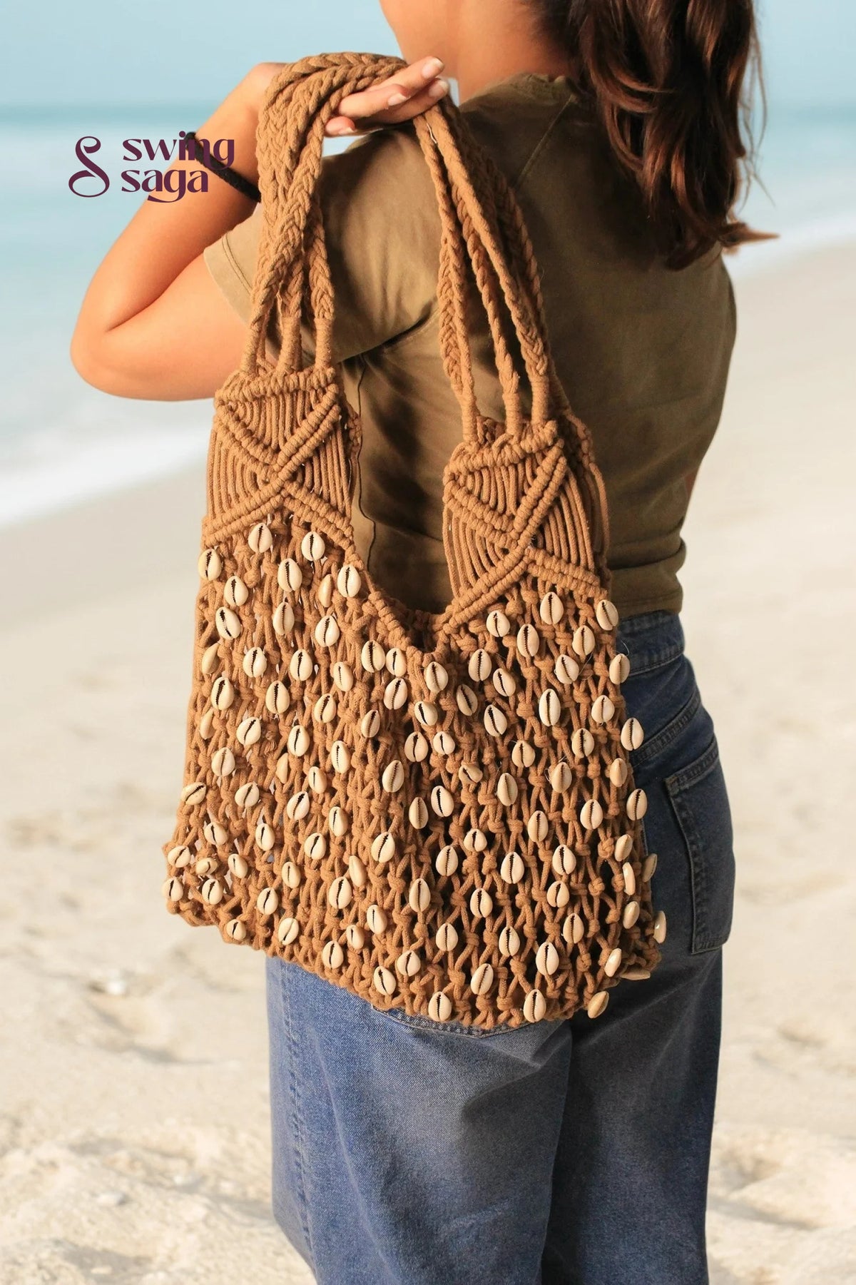 macrame beach bag on a girl shoulder in a brown color for everyday use.