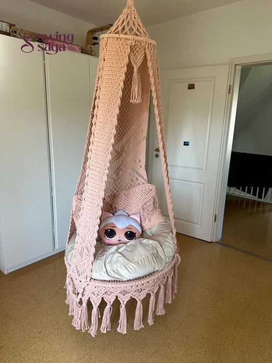 Macrame seater swing with two square shaped macrame cushions and one cartoon face cushion.