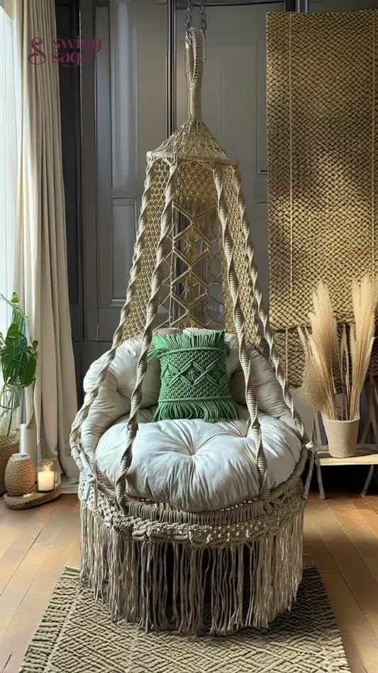 Hanging macrame chair with cushions in a cozy room setting