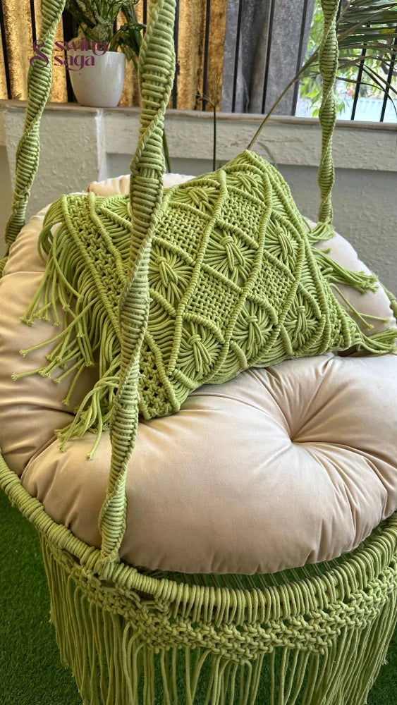 Close up shot of a  green chair swing macrame