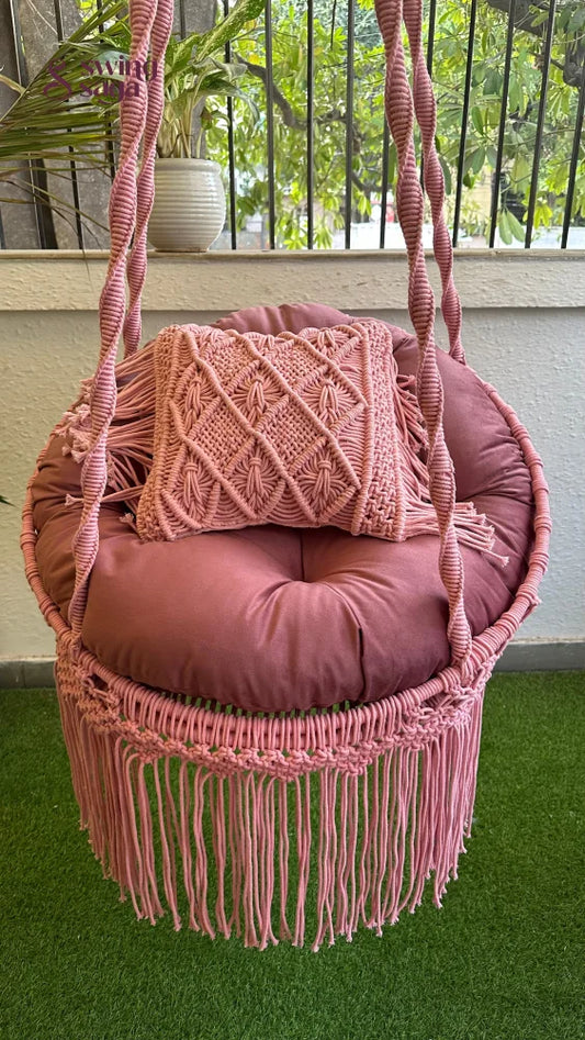 close up of a circular shaped macrame swing.