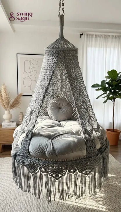 Macrame hanging chair with cushions in a room setting