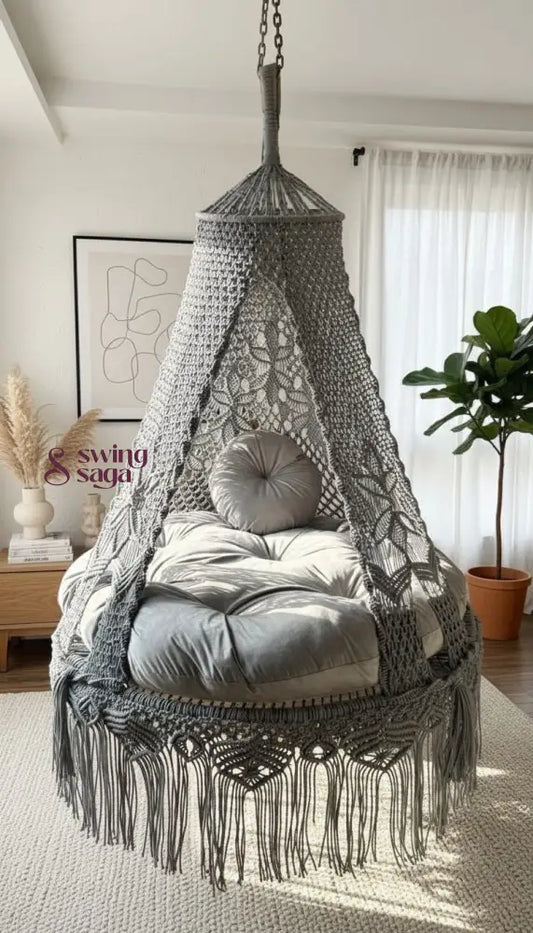 Macrame hanging chair with cushions in a room setting