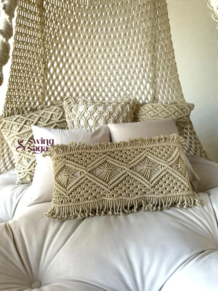 Decorative pillows with macrame patterns on a white cushion