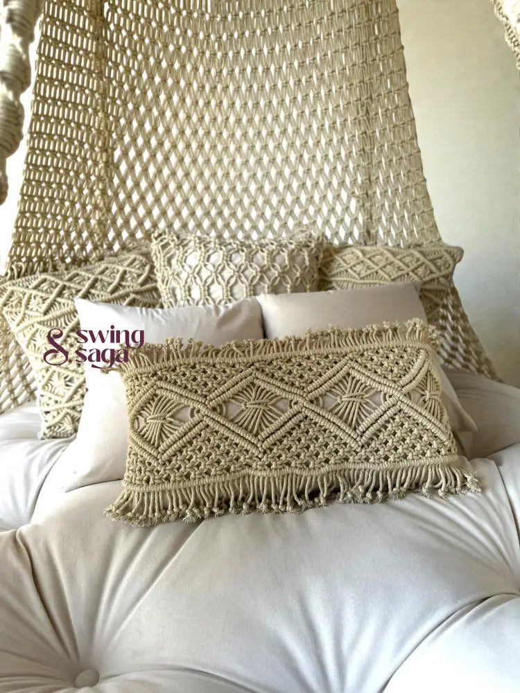 Decorative pillows with macrame patterns on a white cushion