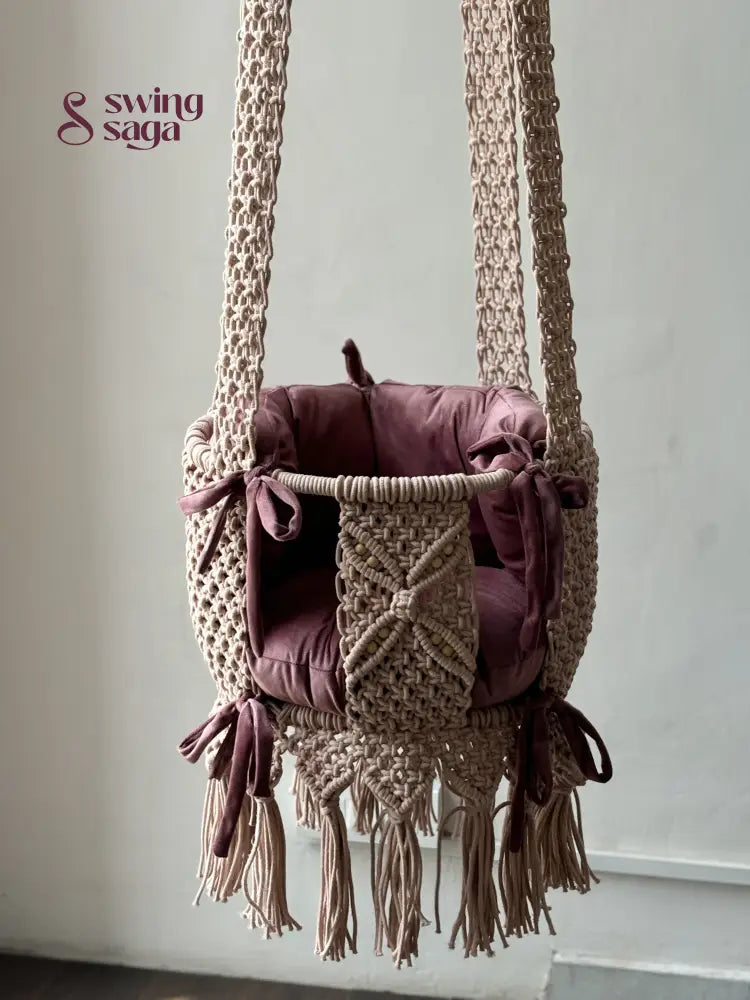 Nursery macrame baby swing in baby pink color. 