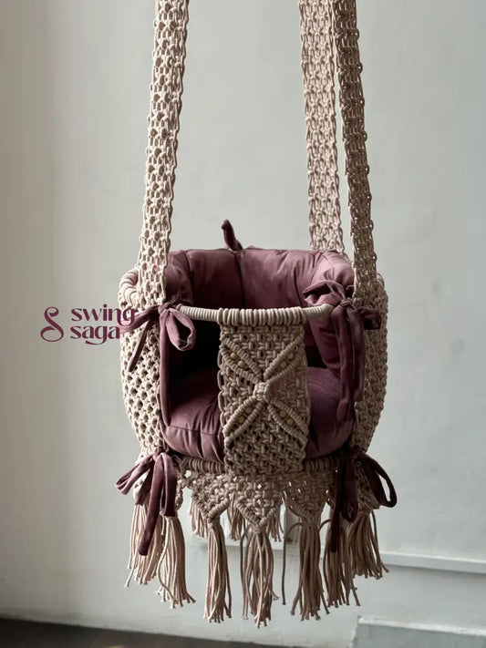 Nursery macrame baby swing in baby pink color. 