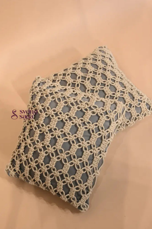 Decorative pillow with a geometric pattern on a beige background