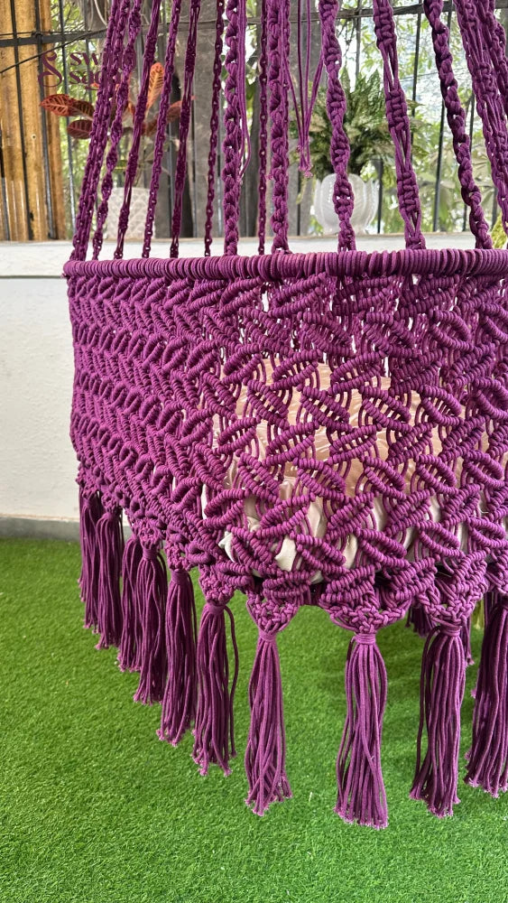 purple handcrafted macrame baby swing for toddlers.