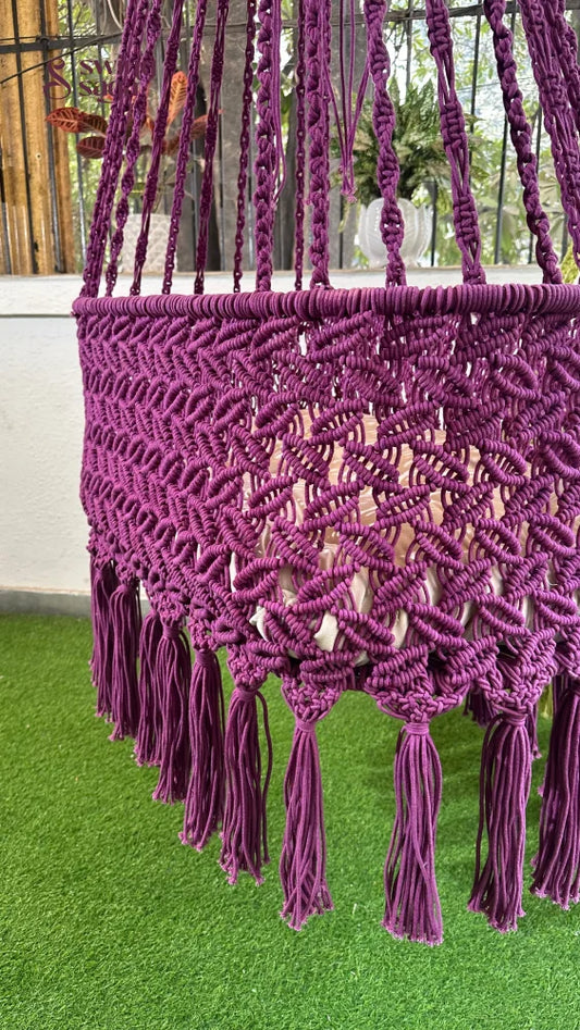 purple handcrafted macrame baby swing for toddlers.