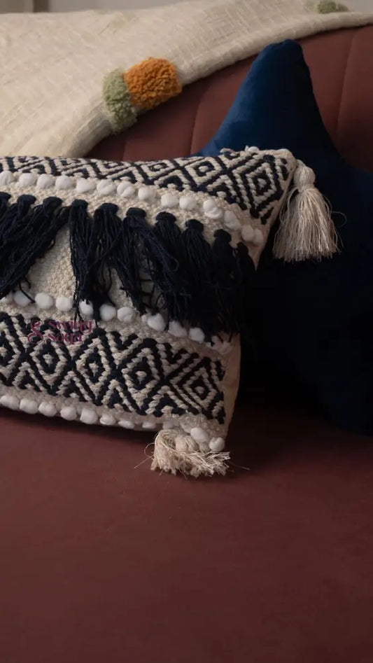 Decorative pillow with tassels on a couch