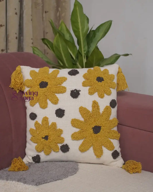 Couch cushion in square shaped with yellow flower print.