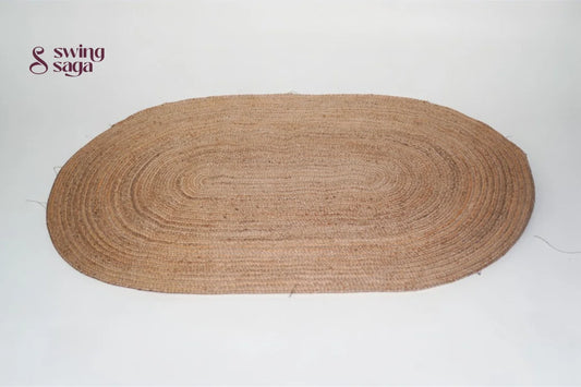Brown oval braided rug on a white background