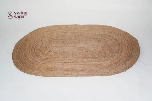 Brown oval braided rug on a white background