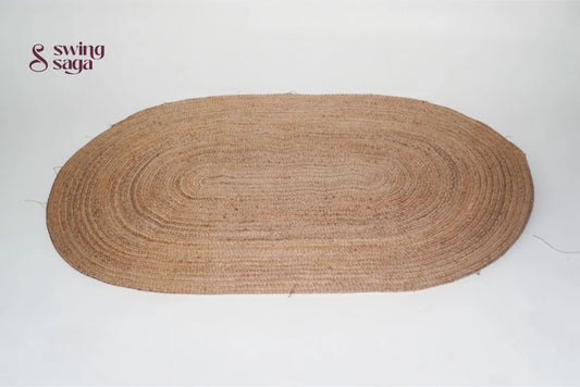 Brown oval braided rug on a white background