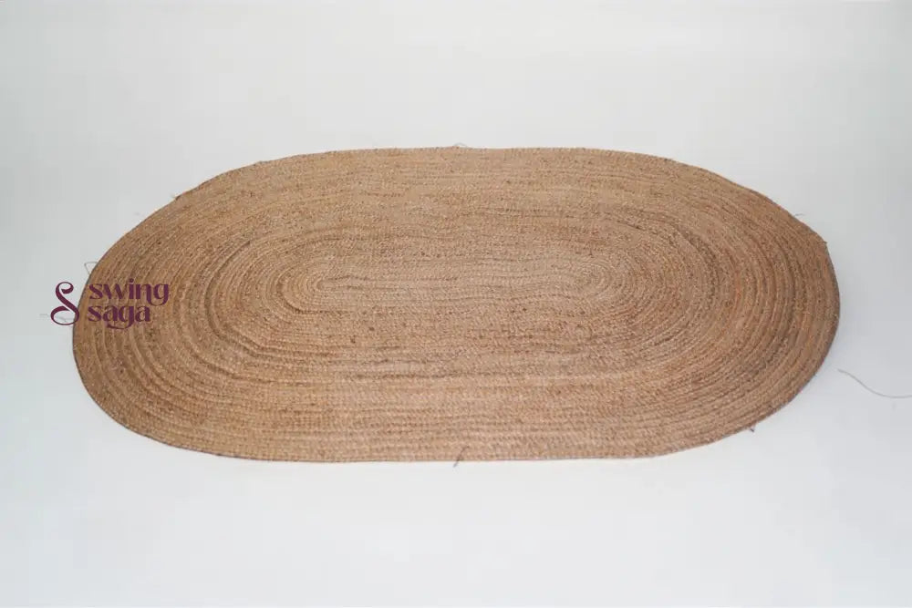 Brown oval braided rug on a white background