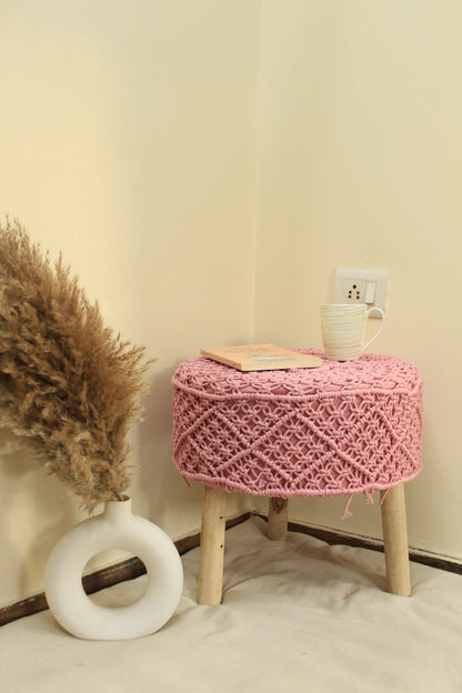 Handcrafted pink macrame ottoman with wooden legs