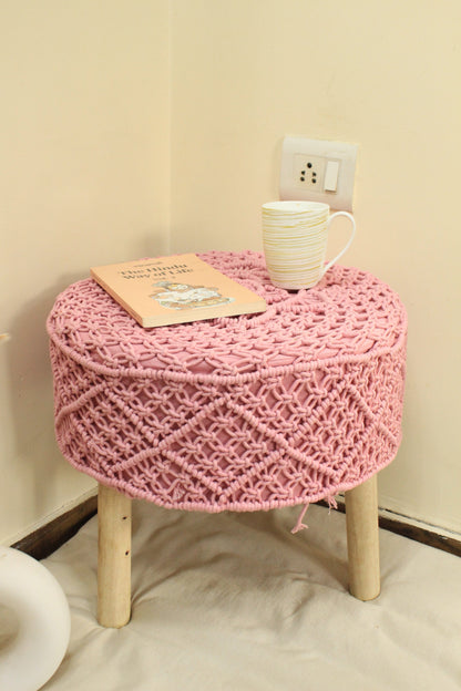 Handcrafted pink macrame ottoman with wooden legs