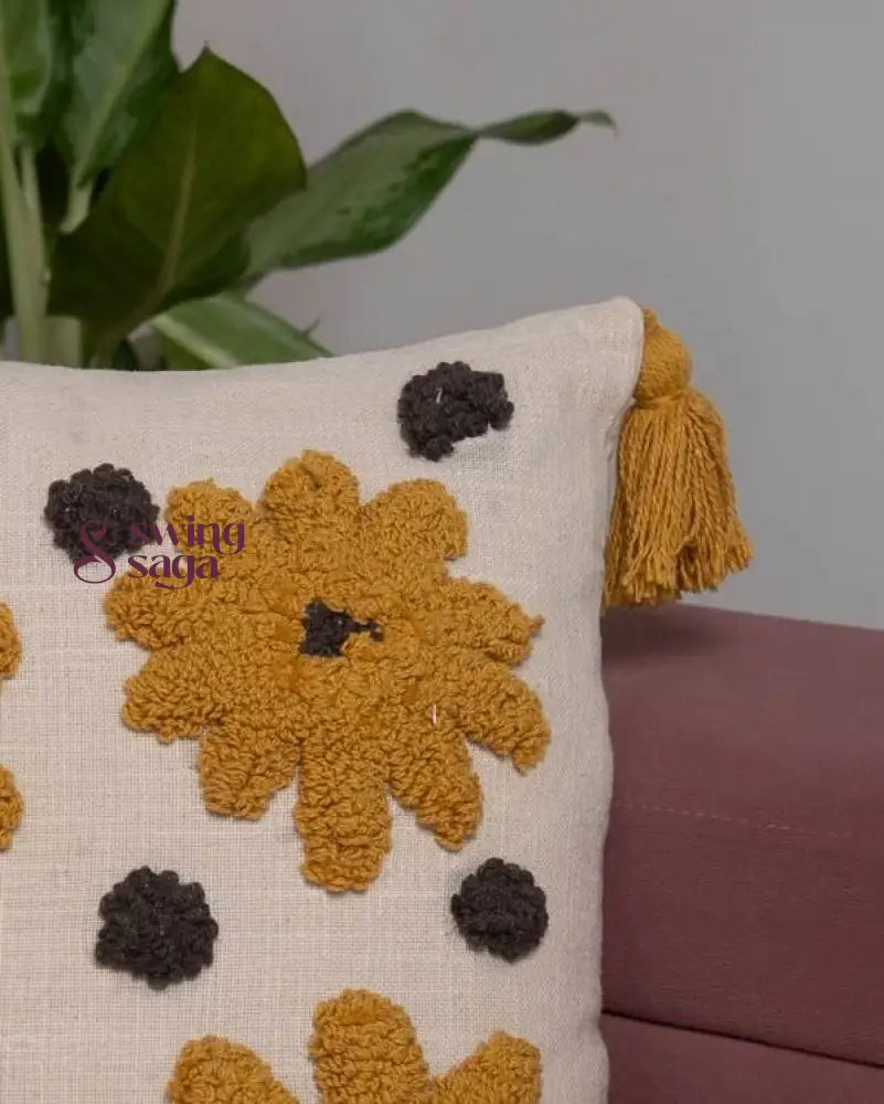 Close up of cushion with Tufted Floral Yellow & Blue Design.