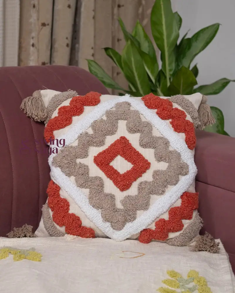 Elegant square throw cushion in orange and white, embossed fabric pillow for sofa, bed, and cozy interiors