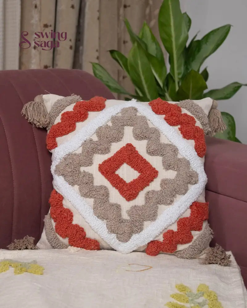 Elegant square throw cushion in orange and white, embossed fabric pillow for sofa, bed, and cozy interiors
