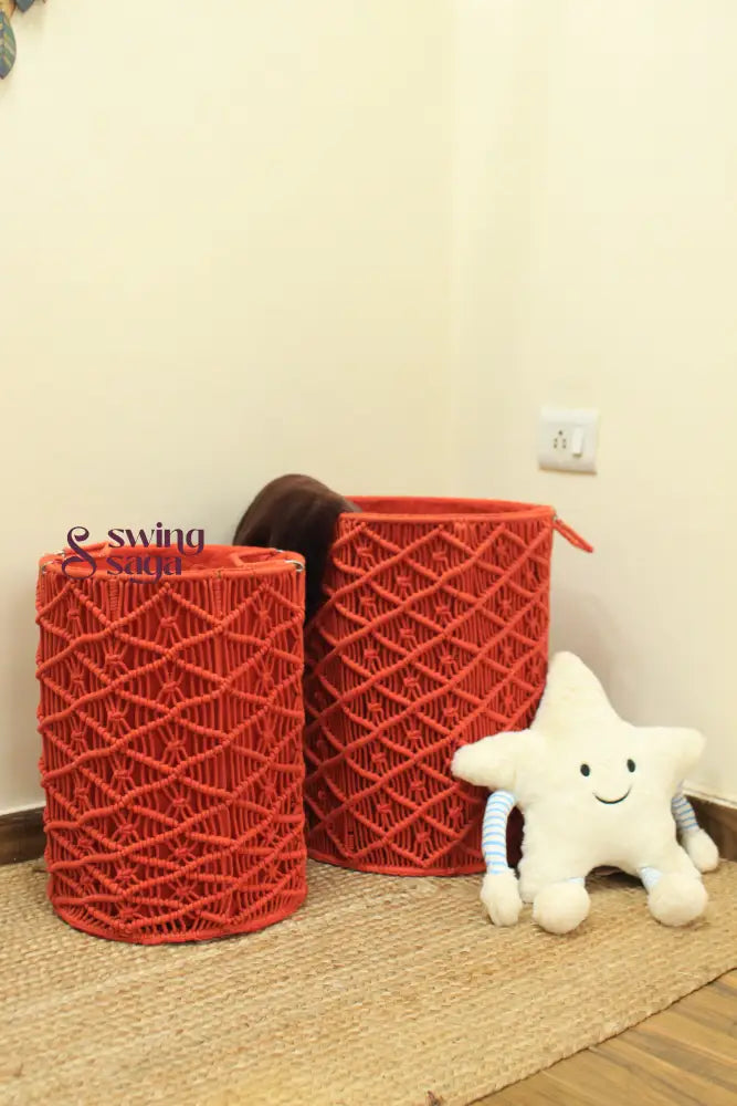 Pair of red handcrated macrame laundry baskets.