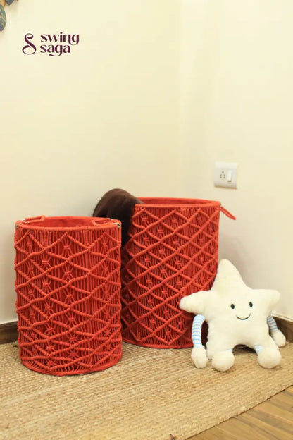 Pair of red handcrated macrame laundry baskets.