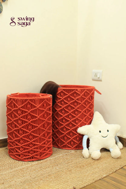 Pair of red handcrated macrame laundry baskets.