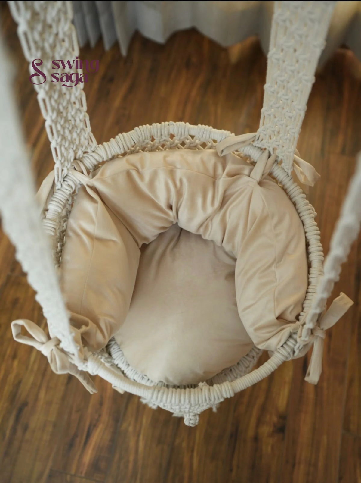 Inside image of mattress in white colored of a macrame baby swing.