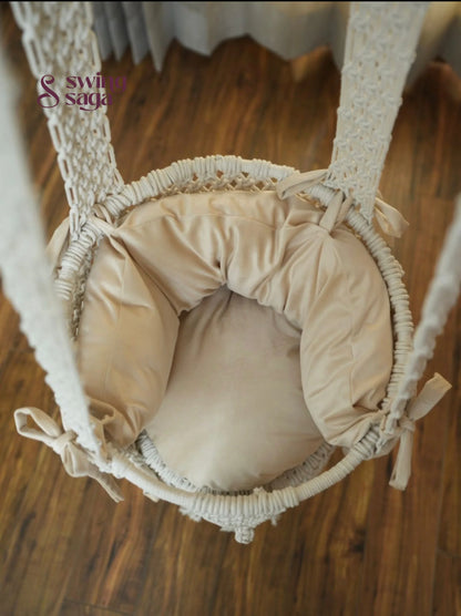 Inside image of mattress in white colored of a macrame baby swing.