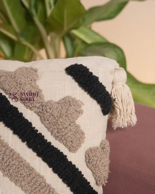 Close up of a cushion in black and cream color
