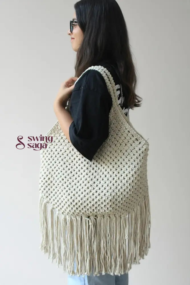 women carrying handcrafted fringe tote shoulder bag with long fringes for everyday use.
