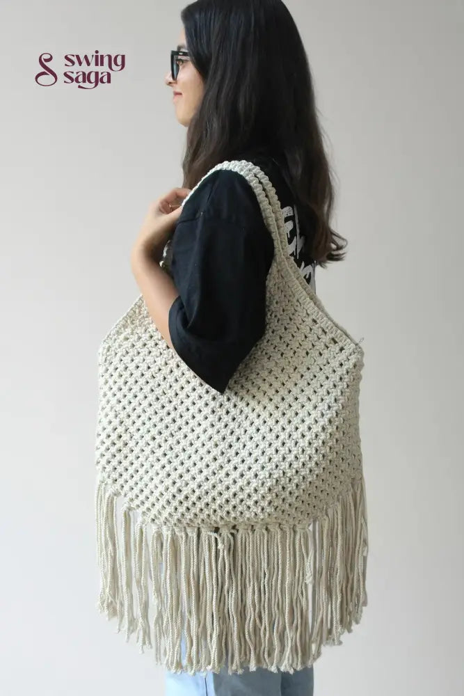women carrying handcrafted fringe tote shoulder bag with long fringes for everyday use.