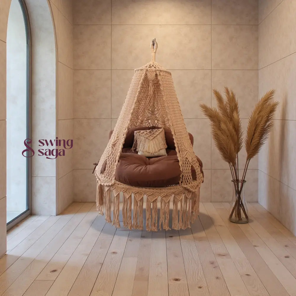 Macrame Swing with canopy in a room with wooden floor and large window