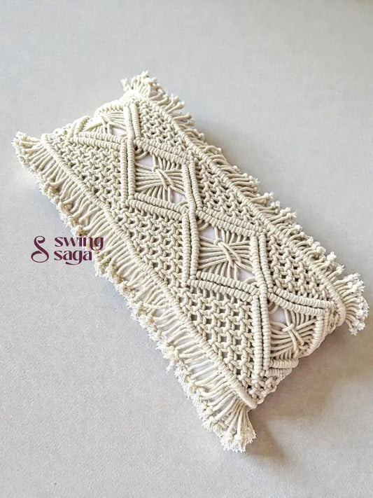 Macrame phone case with geometric pattern on a light gray background