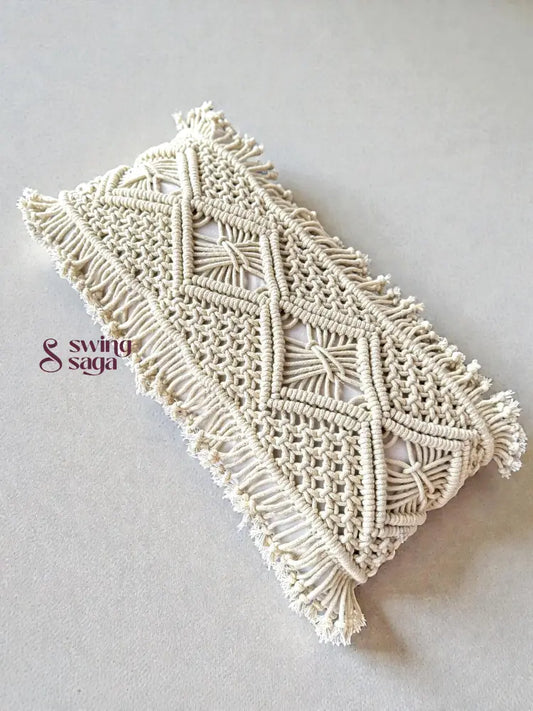 Macrame phone case with geometric pattern on a light gray background